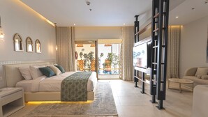 A modern hotel room with a bed, bedside table, and a view of the outdoors. - Sunrise Sentido Mamlouk Palace - All inclusive (Hurghada)