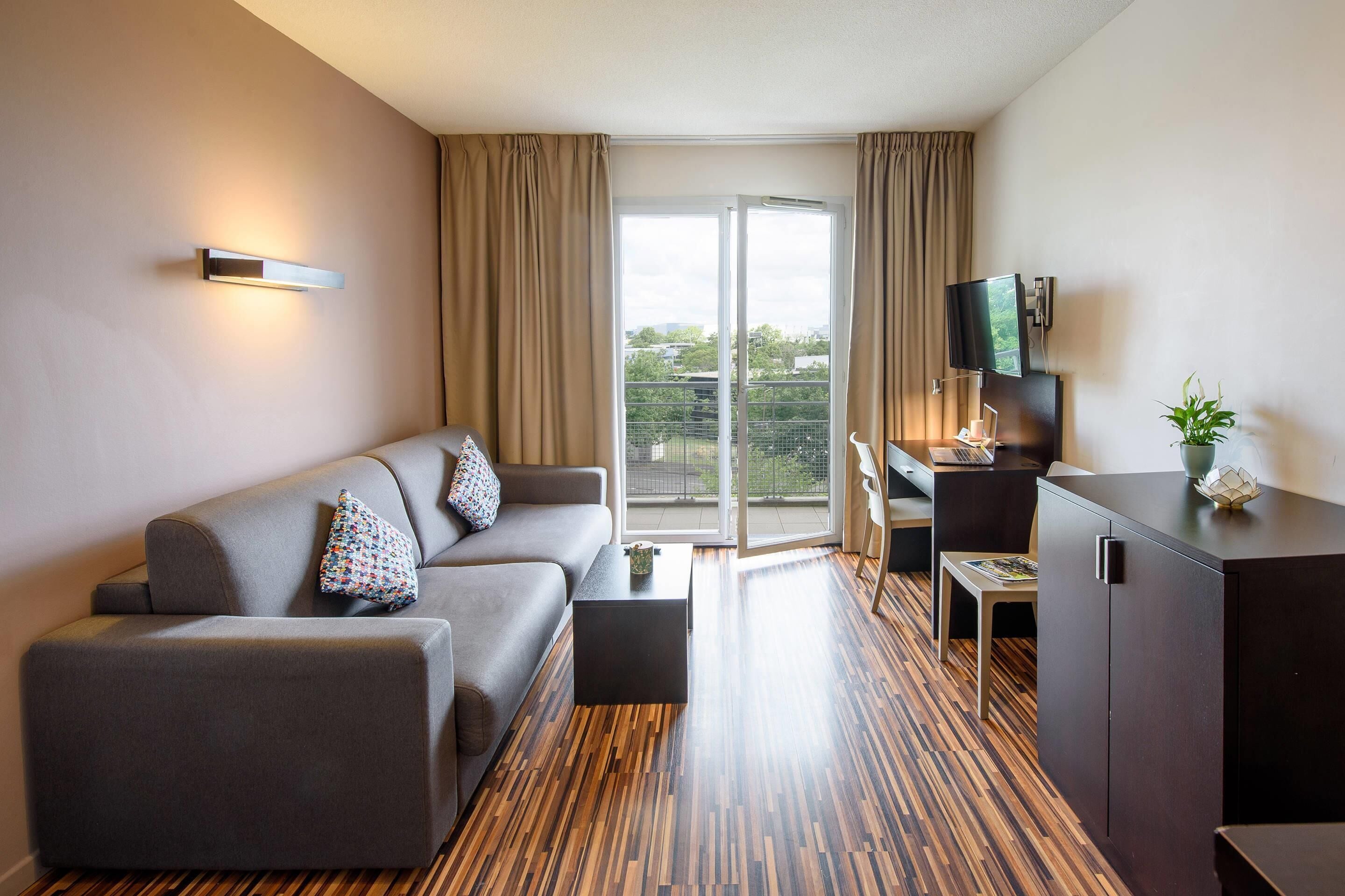 Superior Apartment | Living area | Flat-screen TV