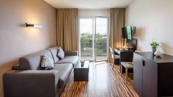 Superior Apartment | Living area | Flat-screen TV