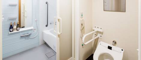 A bathroom with a shower, toilet, and a shelf with toiletries.