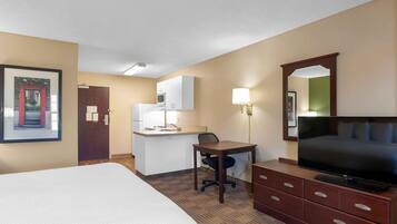 Studio, 1 King Bed, Non Smoking | In-room safe, desk, laptop workspace, iron/ironing board