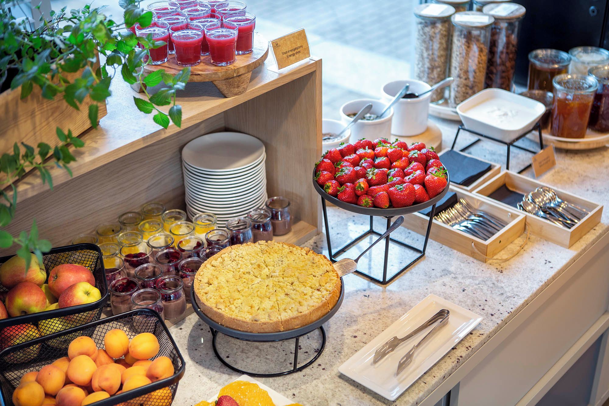 A buffet setup with various food items and beverages.