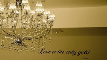A chandelier with multiple arms and hanging crystals.