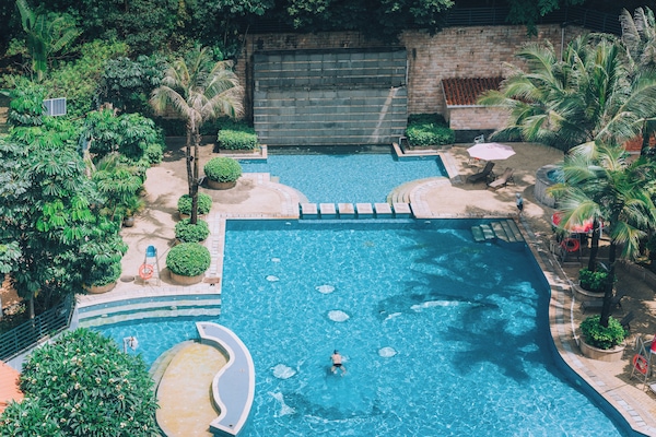 Indoor pool, outdoor pool, pool umbrellas, lifeguards on site