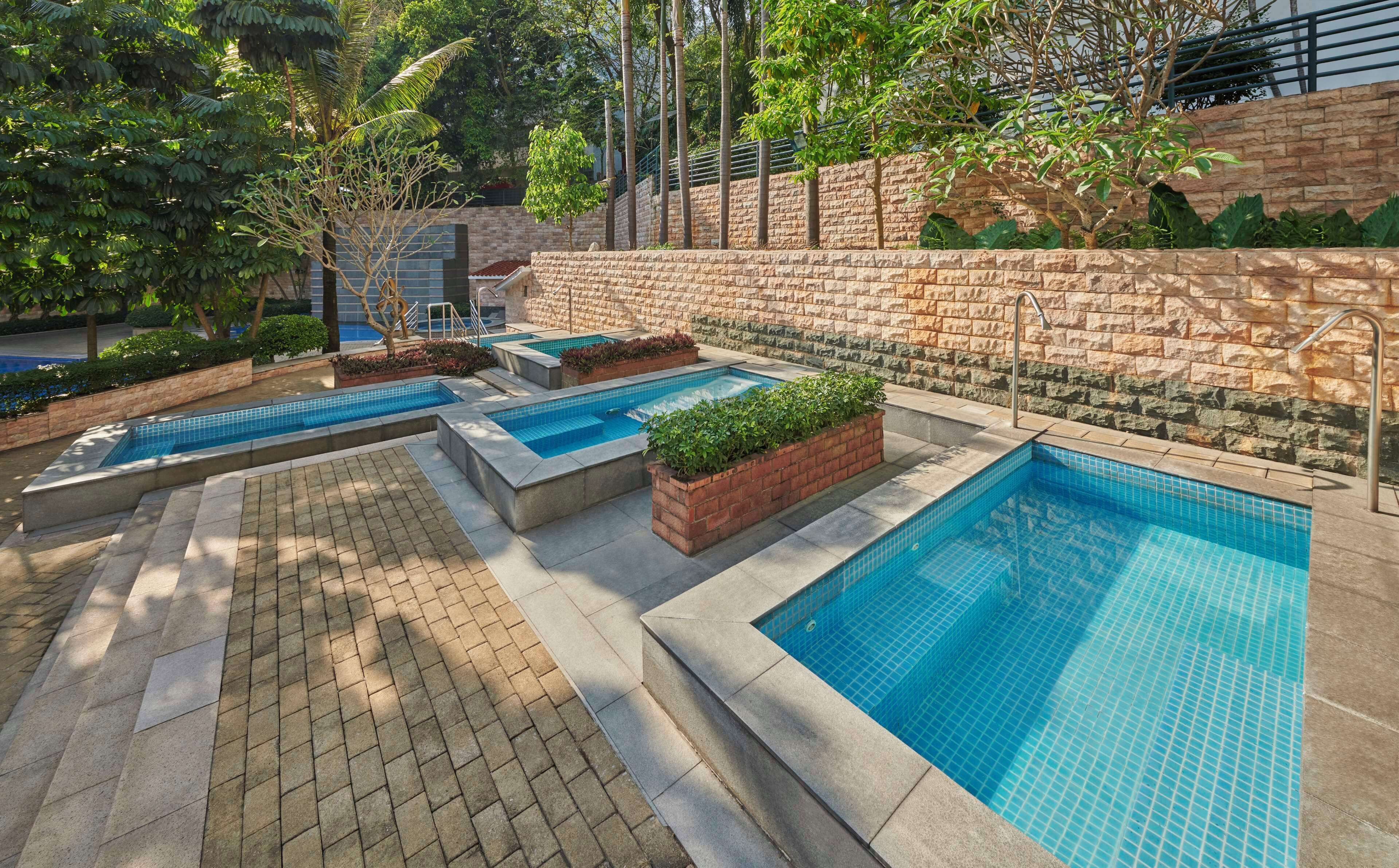 indoor pool, outdoor pool, pool umbrellas, lifeguards on site