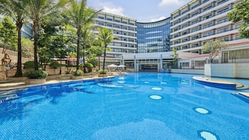 Indoor pool, outdoor pool, pool umbrellas, lifeguards on site