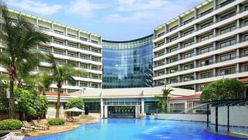 Indoor pool, outdoor pool, pool umbrellas, lifeguards on site