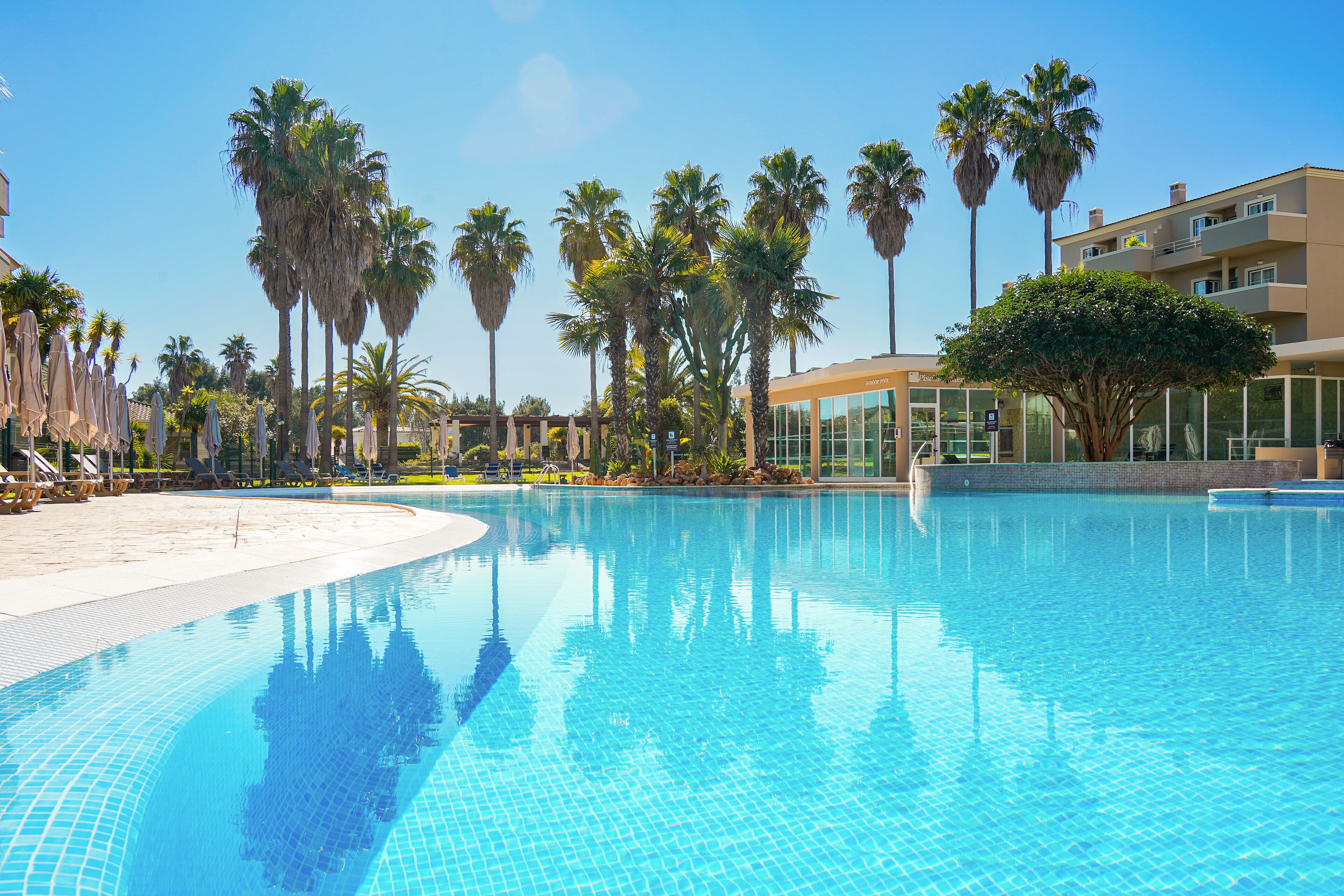 2 outdoor pools, pool umbrellas, pool loungers