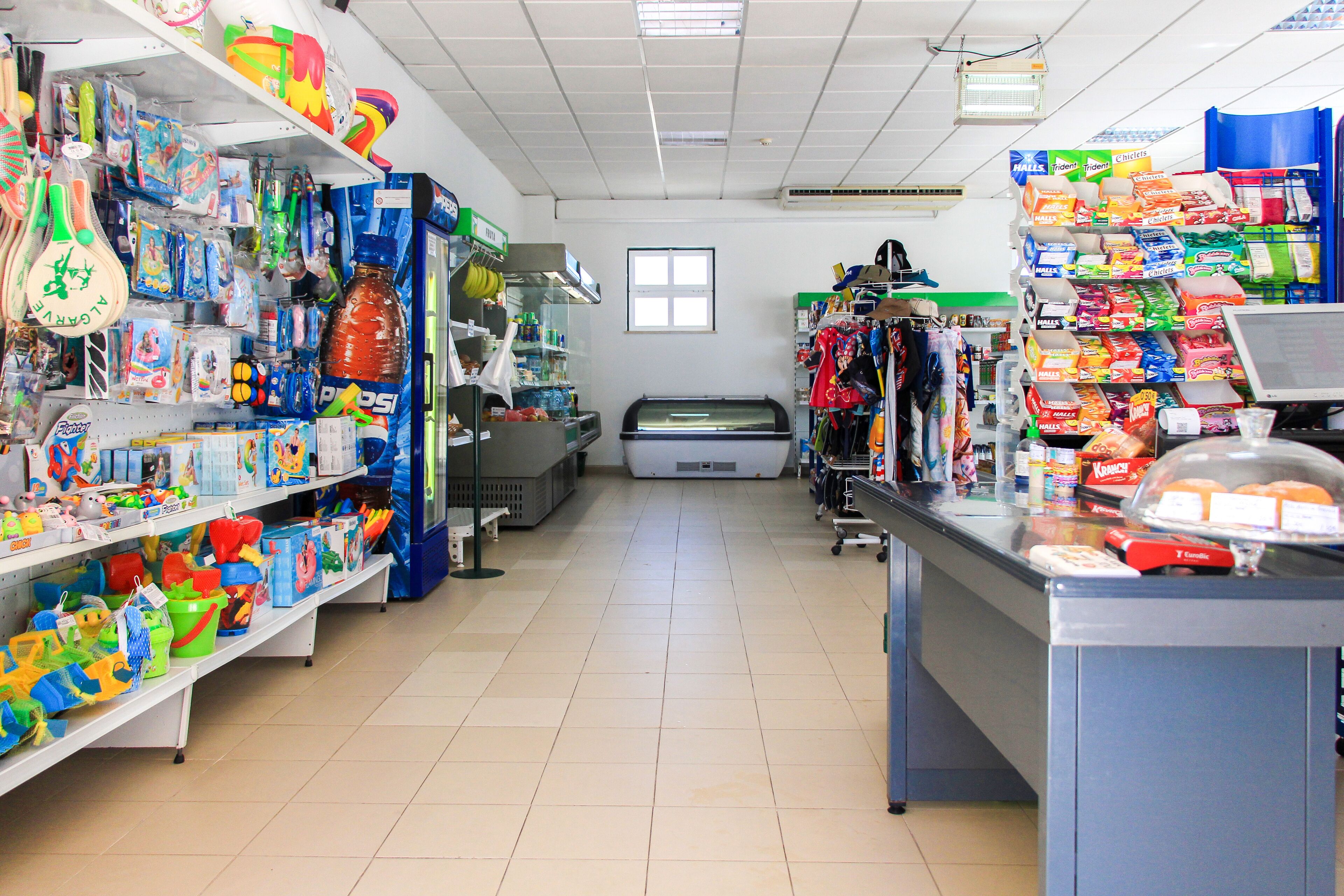 A store with shelves stocked with toys, snacks, and other items.