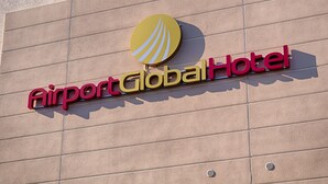 The exterior of the Airport Global Hotel with a prominent logo and signage. - Airport Global Hotel  (Moerfelden-Walldorf)