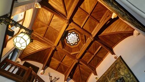 A wooden staircase with intricate railings and a large, ornate ceiling. - Castello Dal Pozzo Resort Lago Maggiore - Preferred Hotels & Resorts  (Oleggio Castello)
