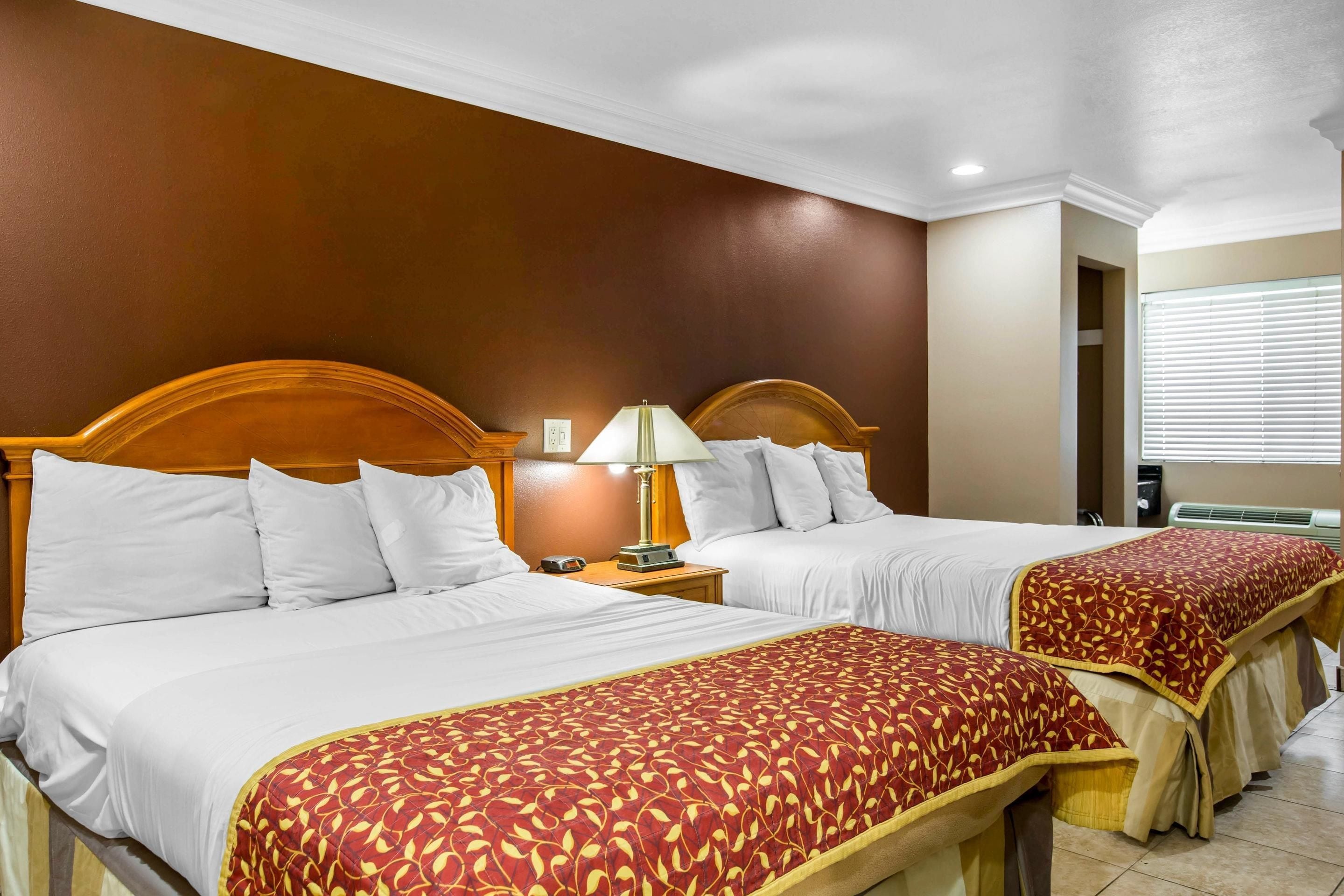 Standard Room, 2 Queen Beds, Non Smoking | Desk, laptop workspace, iron/ironing board, free cribs/infant beds