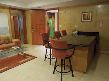32-inch flat-screen TV with satellite channels, TV at The Eldon Luxury Suites