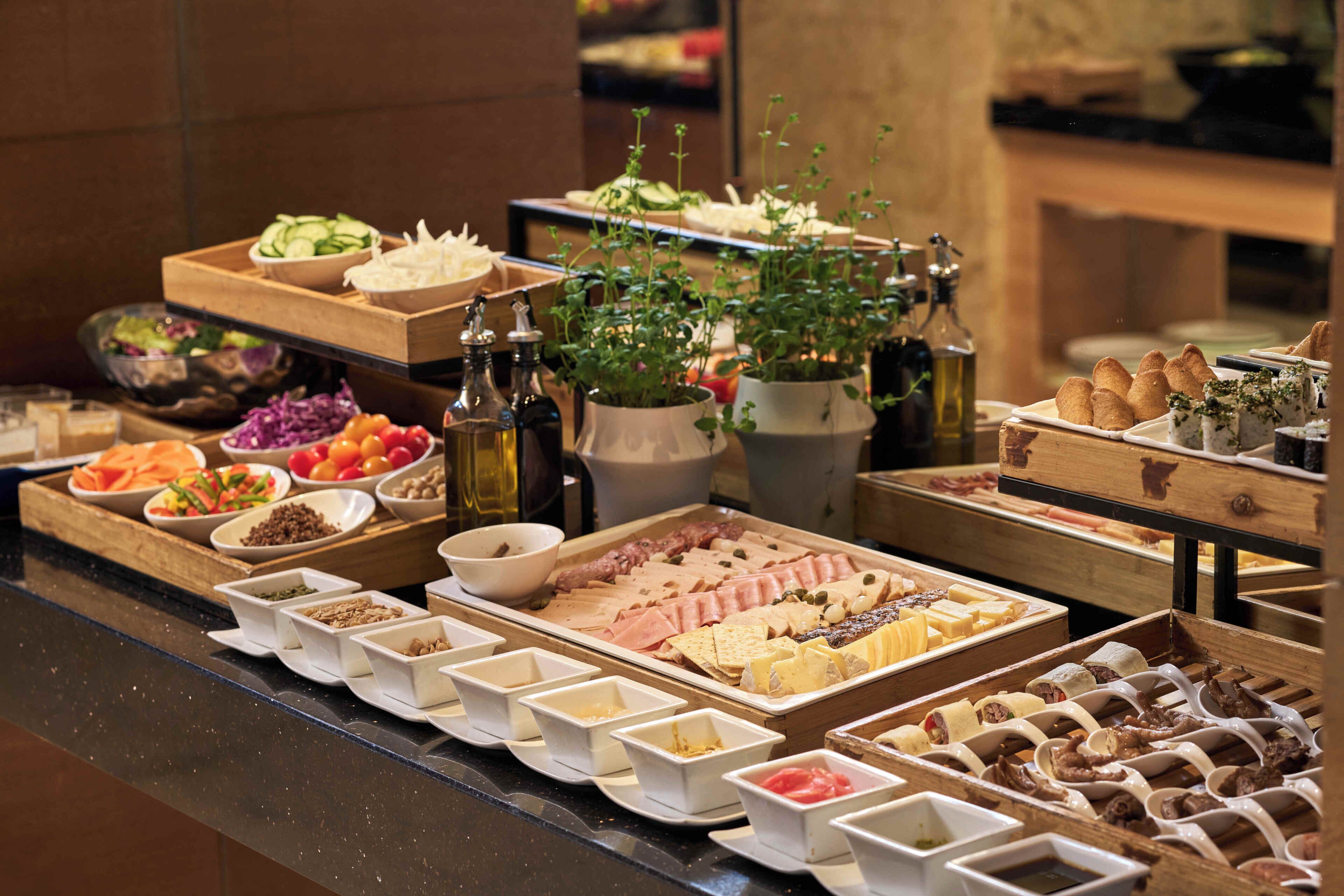 A buffet with various food items and condiments.