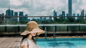 Outdoor pool, open 7:00 AM to 10 PM, pool umbrellas, pool loungers