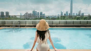 Outdoor pool, open 7:00 AM to 10 PM, pool umbrellas, sun loungers