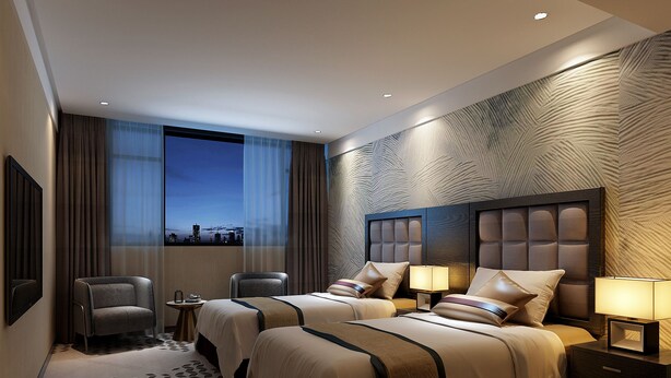 A hotel room with two beds, a chair, a nightstand, and a view of the cityscape. - Henry Business Hotel (Guangzhou)
