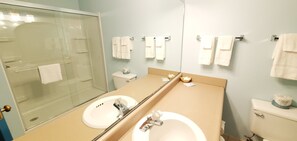 Deluxe Quadruple Room, 2 Queen Beds | Bathroom | Hair dryer, towels