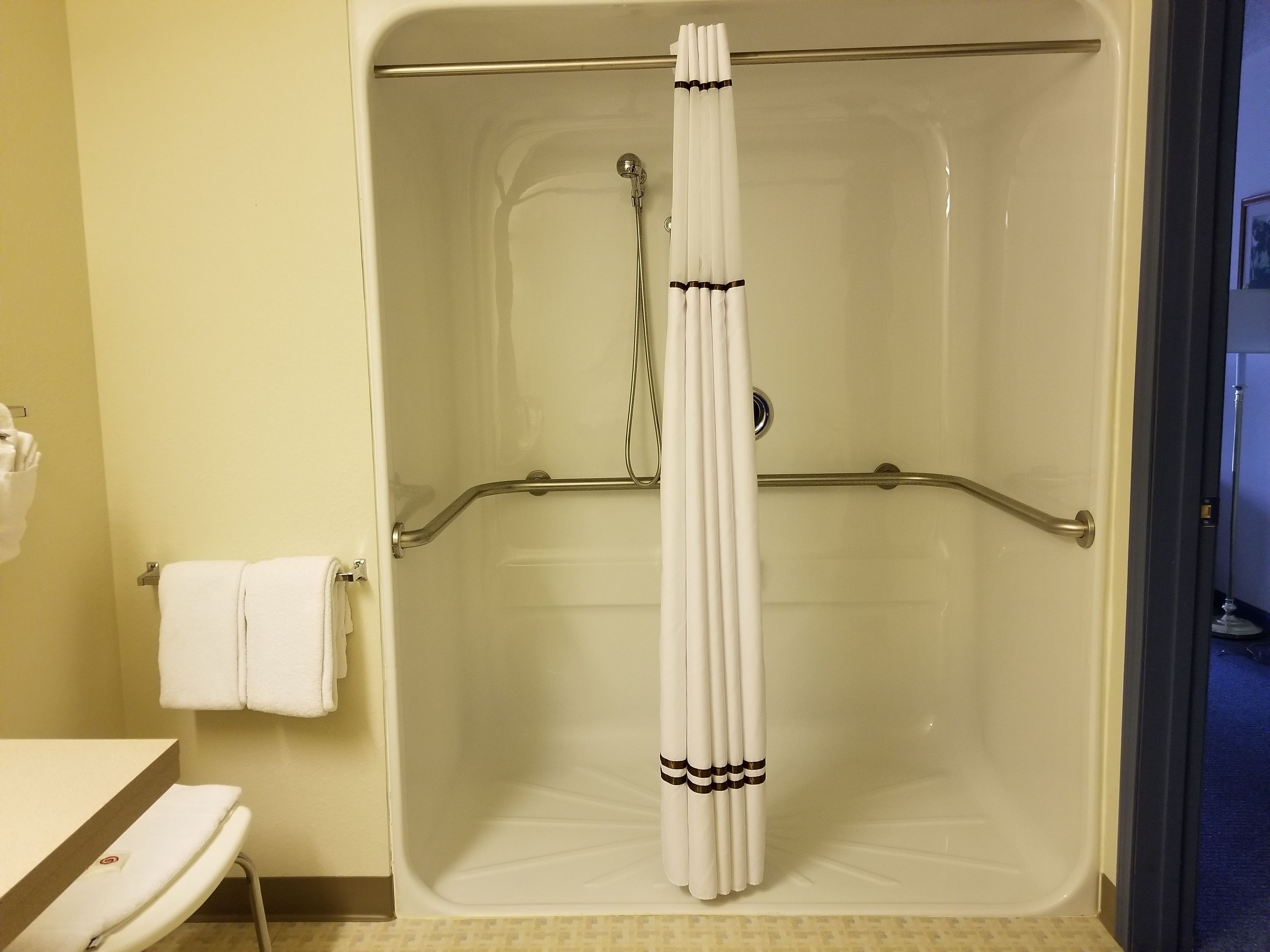 standard single room, 1 king bed, accessible, refrigerator & microwave | bathroom | combined shower/bathtub, free toiletries, hair dryer, towels