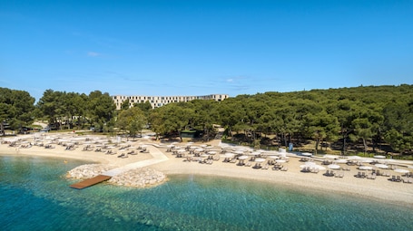 On the beach, sun loungers, beach umbrellas, beach towels