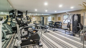 A gym with various exercise equipment, including treadmills, stationary bikes, and weight machines. - Candlewood Suites Jacksonville East Merril Road by IHG (Jacksonville)