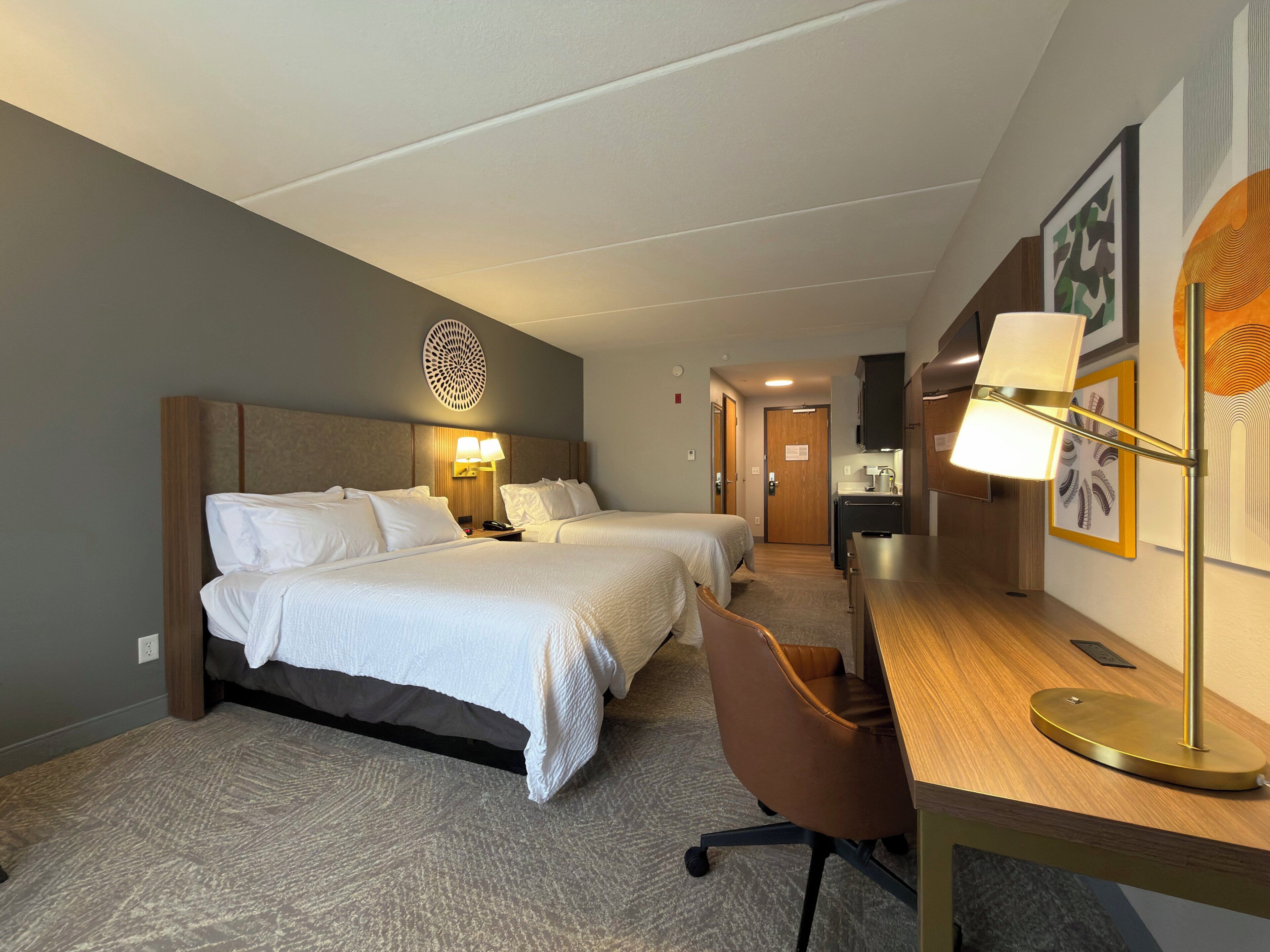 Desk, blackout drapes, iron/ironing board, free cribs/infant beds