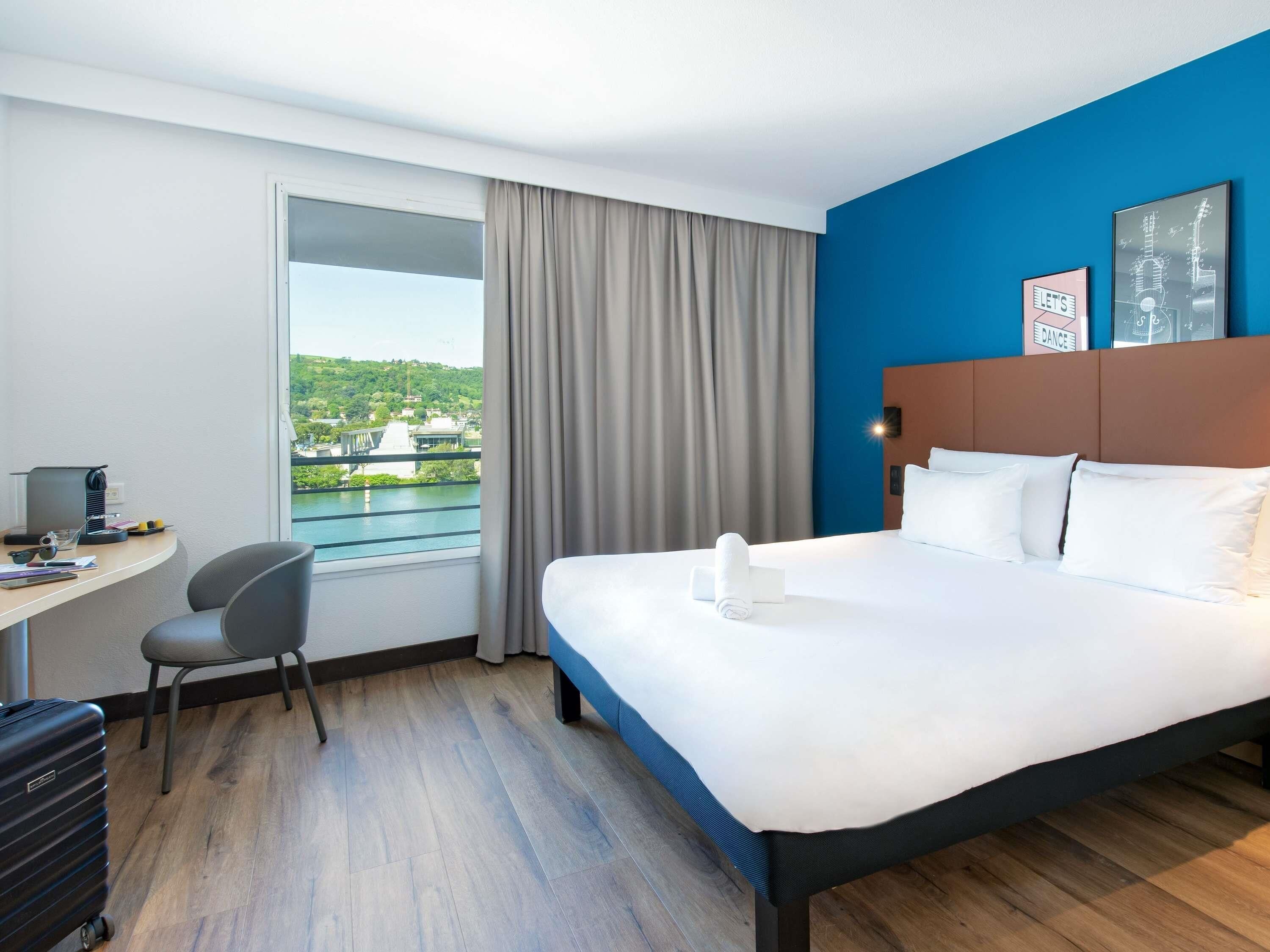 Premium bedding, desk, laptop workspace, blackout curtains