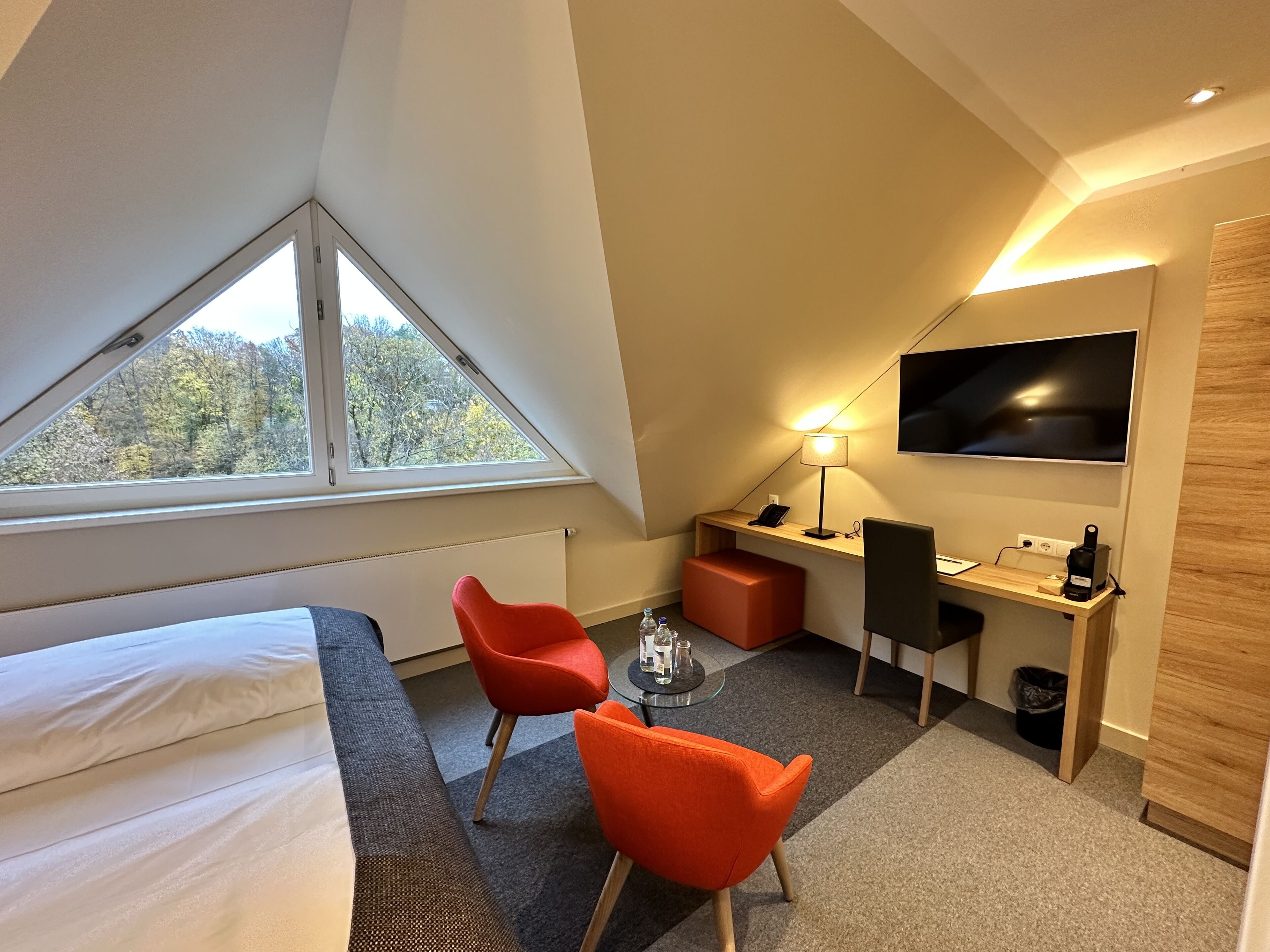 premium double room | living area | 35-inch flat-screen tv with satellite channels, tv, first-run films