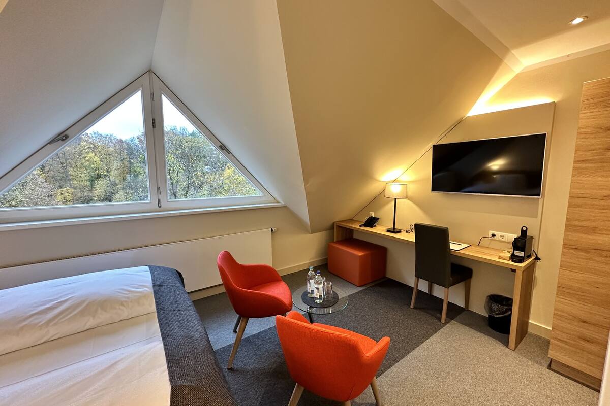 premium double room | living area | 35-inch flat-screen tv with satellite channels, tv, first-run films