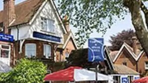 A traditional building with a pitched roof and a visible entrance. - The Victoria Hotel (Canterbury)