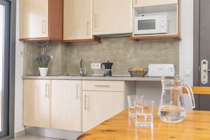 Fridge, microwave, cookware/dishes/utensils