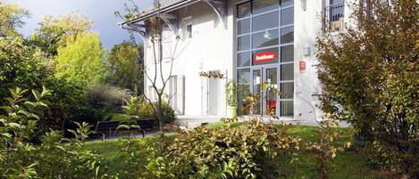 A building with a sign reading 'ResiHome' indicating a residential property.