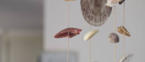 A hanging decoration of various seashells.