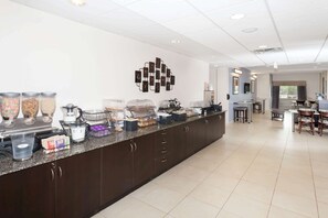 Enjoy a convenient breakfast bar with a coffee machine, fruit bowl, and condiments.
