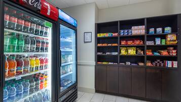 A vending machine stocked with various beverages and snacks.
