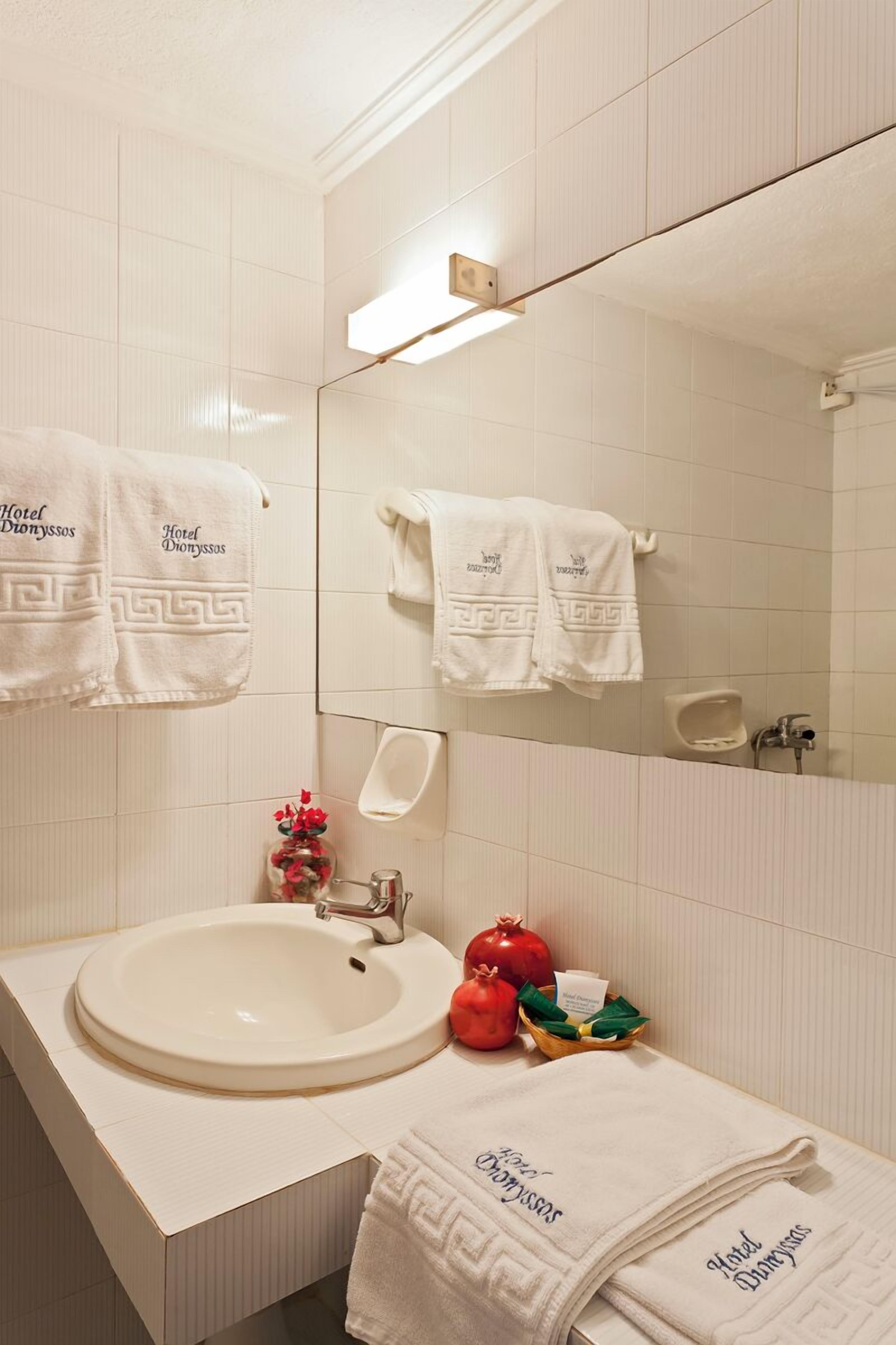 shower, rainfall showerhead, hair dryer, towels