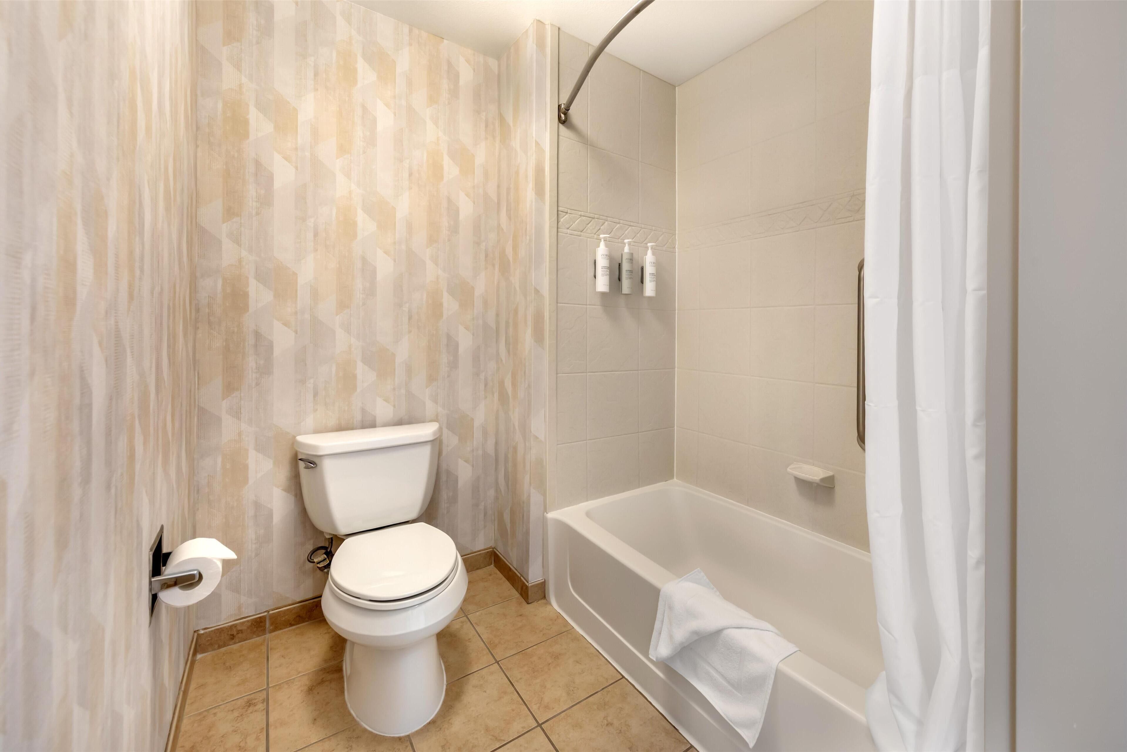 studio suite, 1 king bed with sofa bed | bathroom | free toiletries, hair dryer, bathrobes, towels