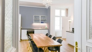 A modern kitchen with a dining area.