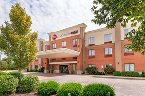 A hotel with a red brick facade, a covered entrance, and a sign reading "Best Western PLUS". - Best Western Plus Olathe Hotel (Olathe)