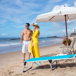 On the beach, white sand, sun-loungers, beach umbrellas