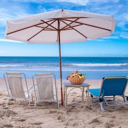 On the beach, white sand, sun-loungers, beach umbrellas
