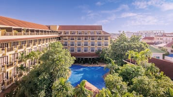 Outdoor pool, open 7 AM to 9 PM, pool umbrellas