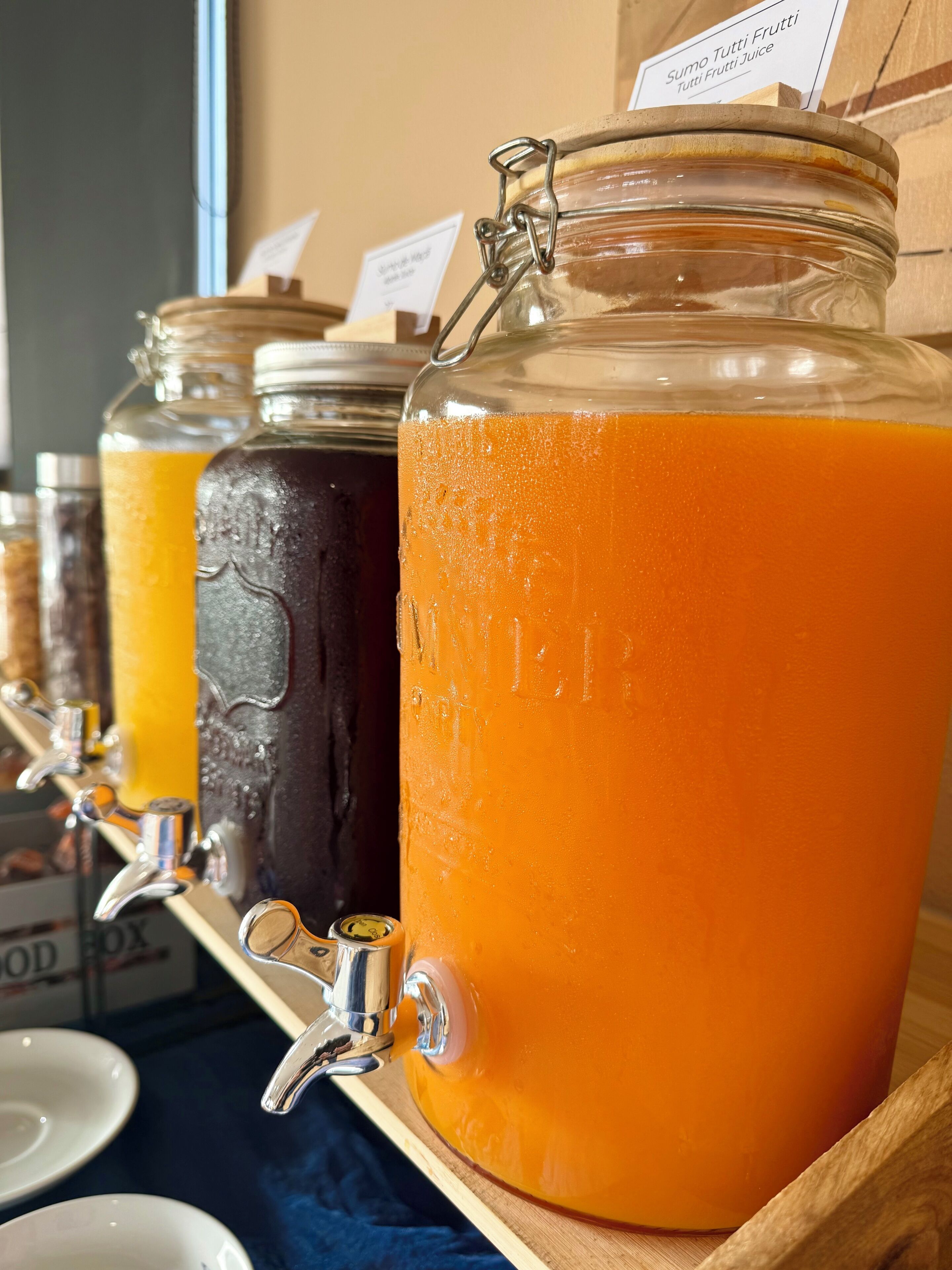 A juice dispenser with multiple containers.