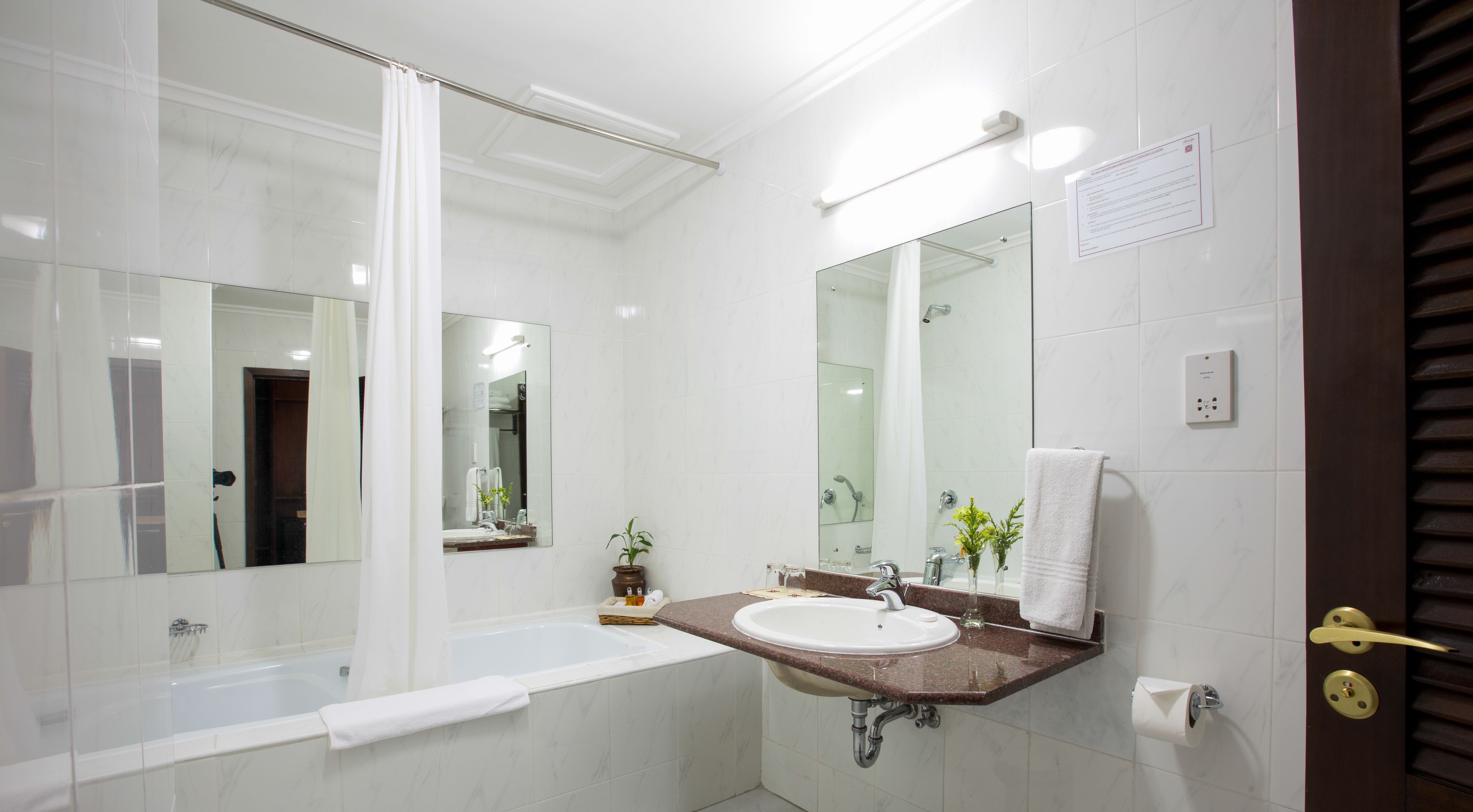 executive room | bathroom | separate bathtub and shower, designer toiletries, hair dryer, slippers