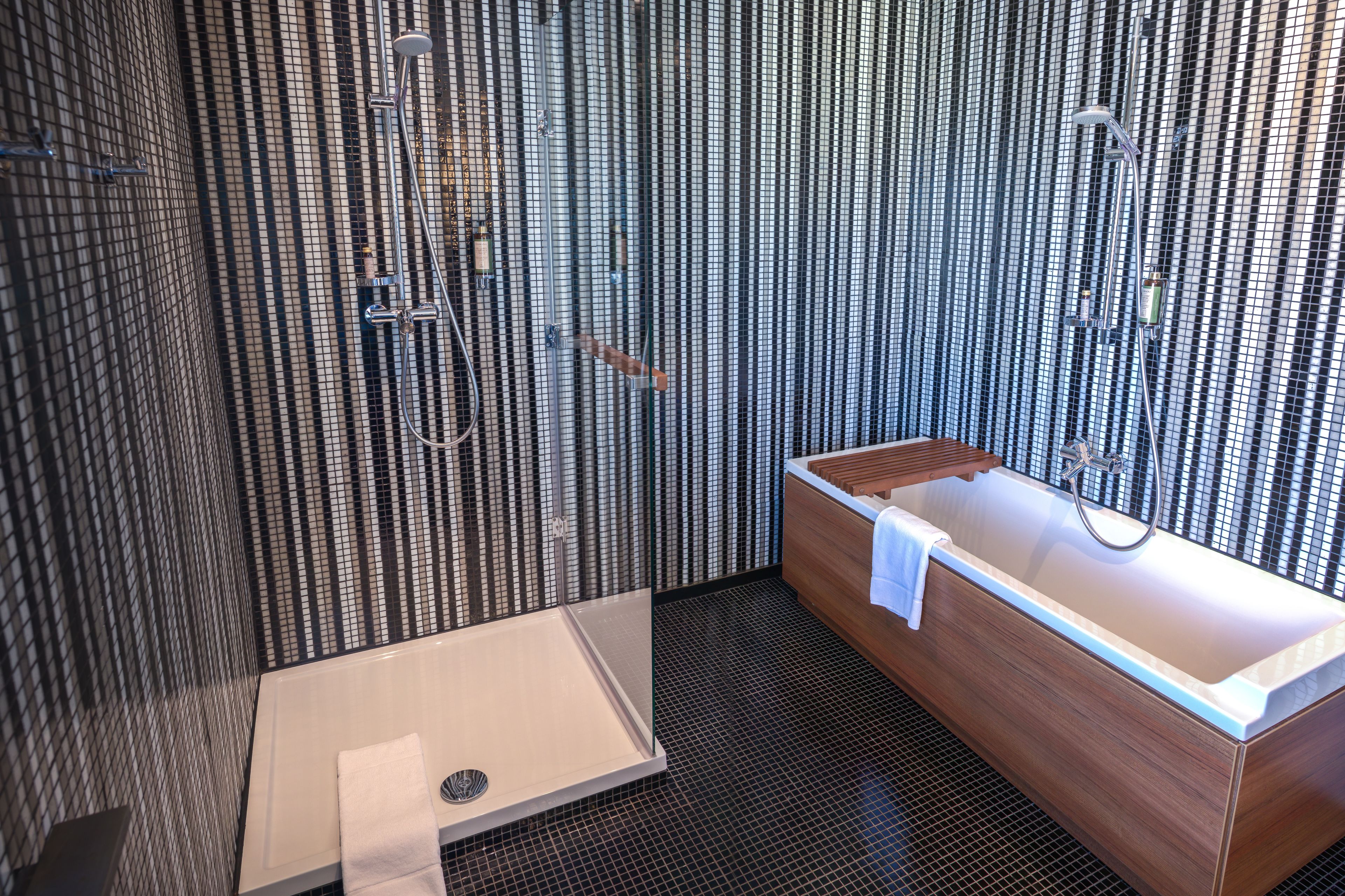 deep-soaking bathtub, designer toiletries, hair dryer, towels