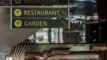 Directional signs for a restaurant and garden.