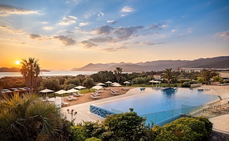 Indoor pool, seasonal outdoor pool, pool umbrellas, sun loungers