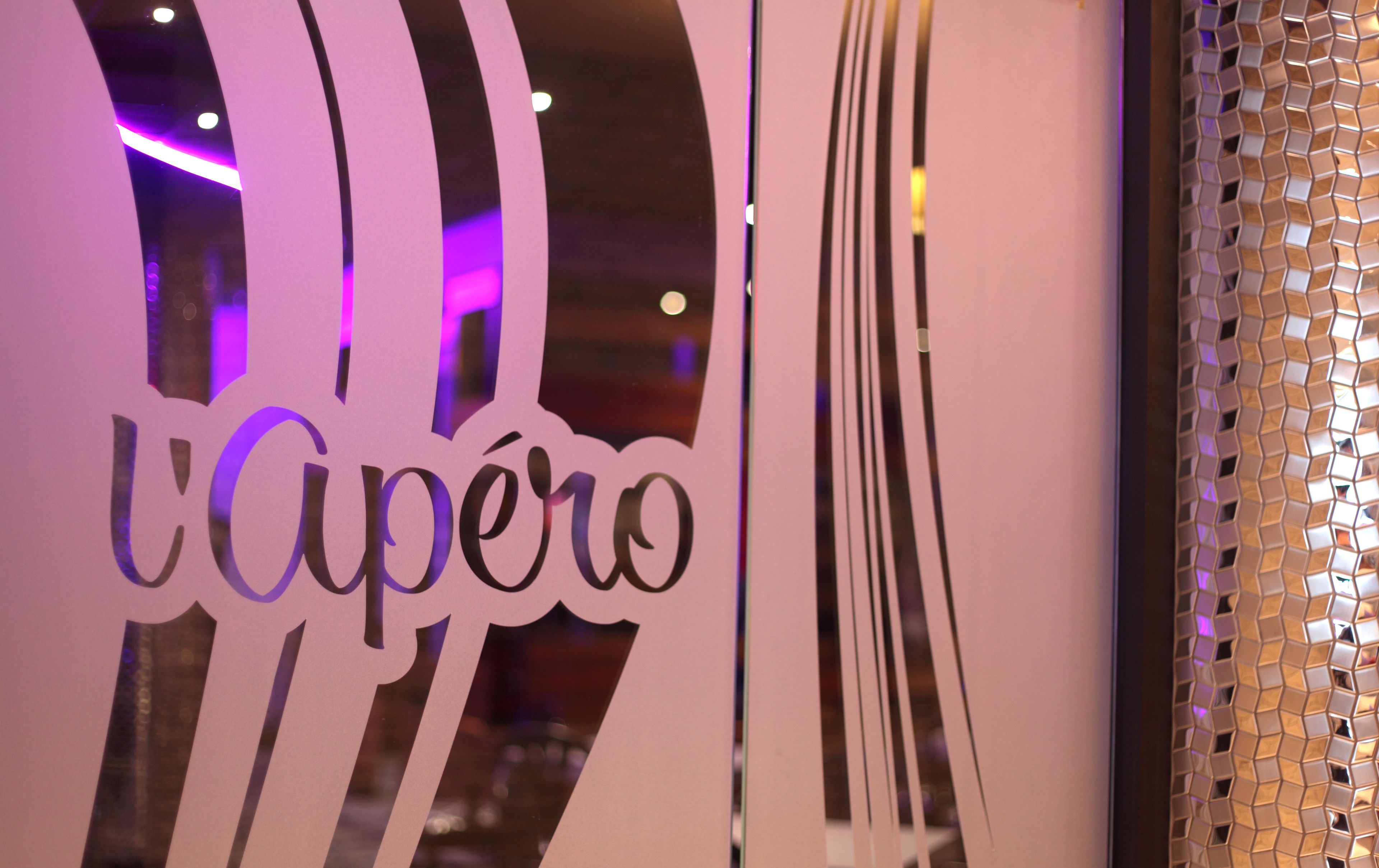 A close-up of a wall with the word "Capero" in stylized lettering, suggesting a hotel or establishment's name.