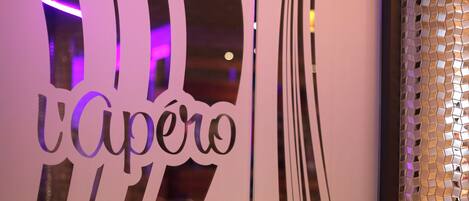 A close-up of a wall with the word "Capero" in stylized lettering, suggesting a hotel or establishment's name.