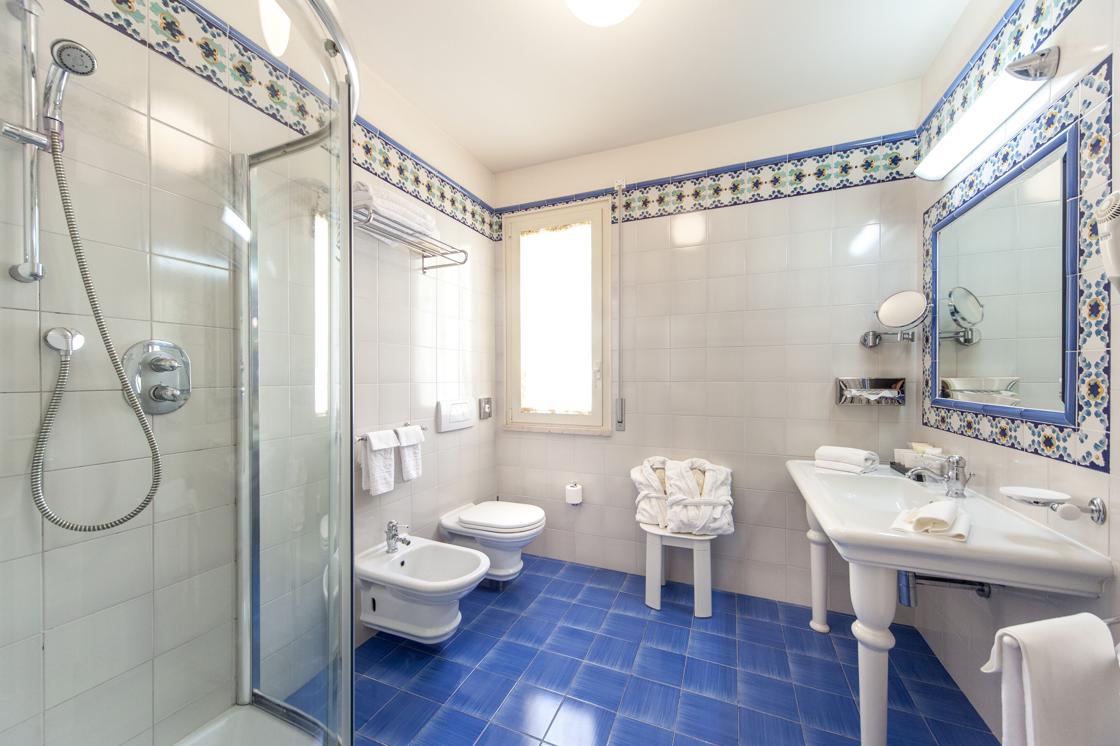 combined shower/bathtub, free toiletries, hair dryer, bathrobes